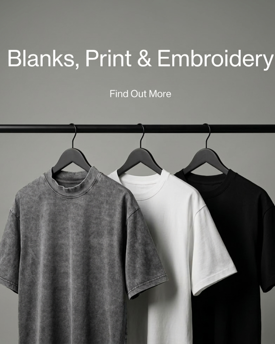 Blank T-shirts hanging on a rail for streetwear and merch.